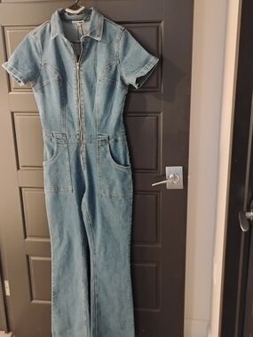 Medium  BlueWashed Denim Zip-Front Jumpsuitwith Front And Back Pockets